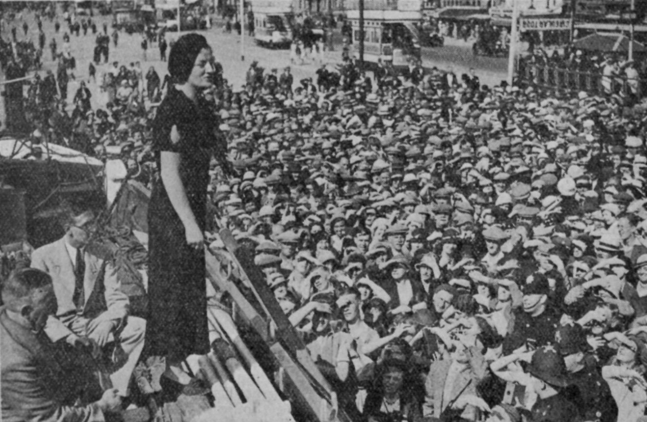 Mss Gracie Fields using the life boat as a stage Blackpool 1934